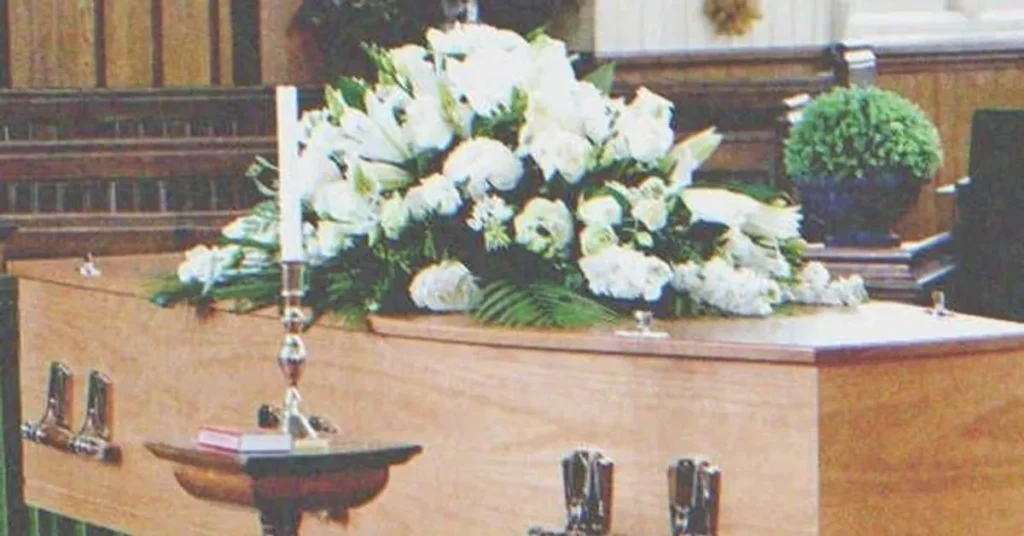 Flowers on top of a coffin | Source: Shutterstock