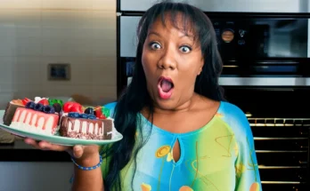 A startled woman holding a cake | Source: Shutterstock