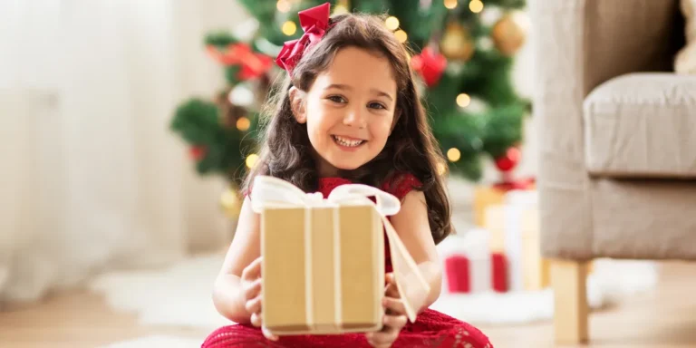 A girl holding a present | Source: Shutterstock