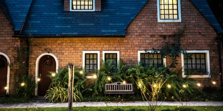 A beautiful red brick house with decorative lights | Source: Shutterstock