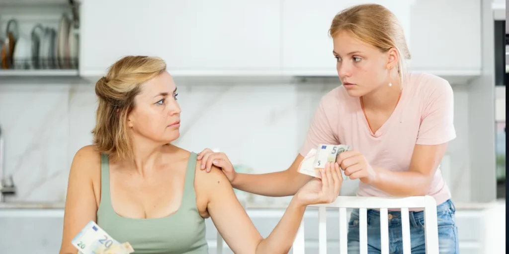 A young woman demanding money from her mother | Source: Shutterstock