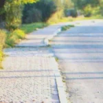 A kid walking down a street | Source: Shutterstock