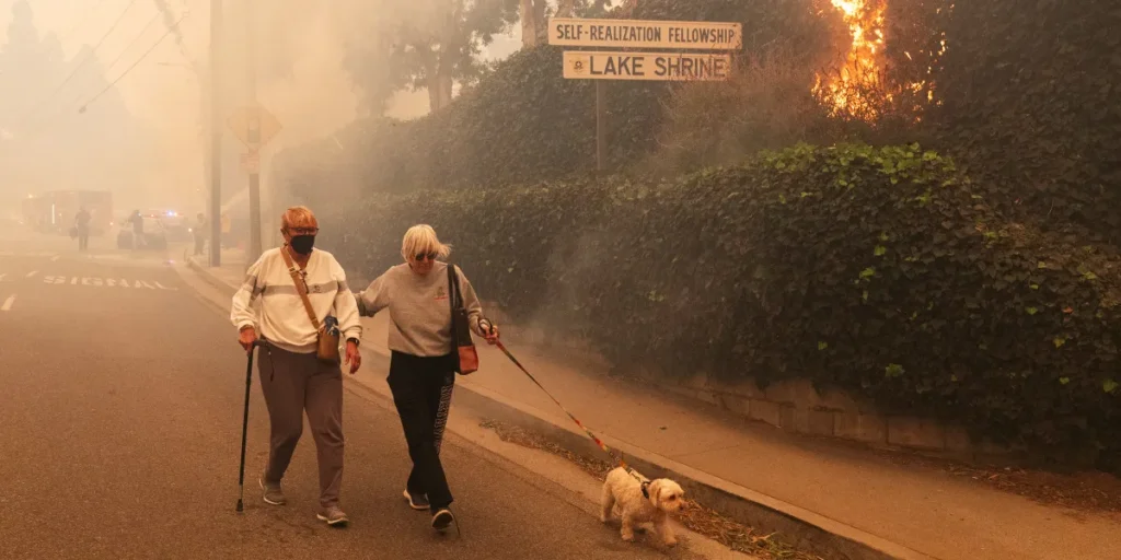 Residents evacuating their home | Source: Getty Images