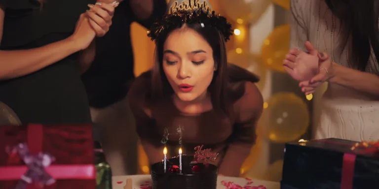 A girl blowing her birthday candles | Source: Shutterstock