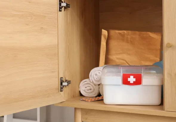 A first aid kit inside a cabinet | Source: Shutterstock