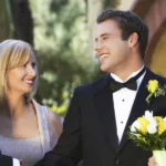 A bride and groom with an older couple | Source: Shutterstock