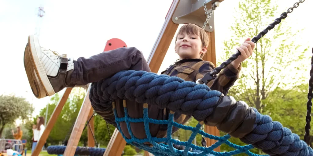 A little boy on a swing | Source: Shutterstock