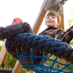 A little boy on a swing | Source: Shutterstock