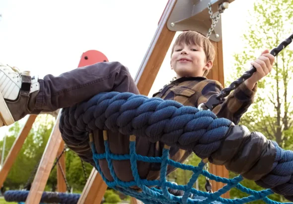 A little boy on a swing | Source: Shutterstock