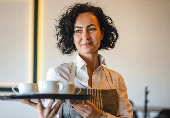 Woman working as a waitress | Source: Shutterstock