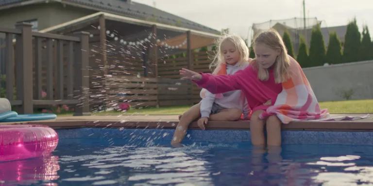 Kids playing near the pool | Source: Shutterstock